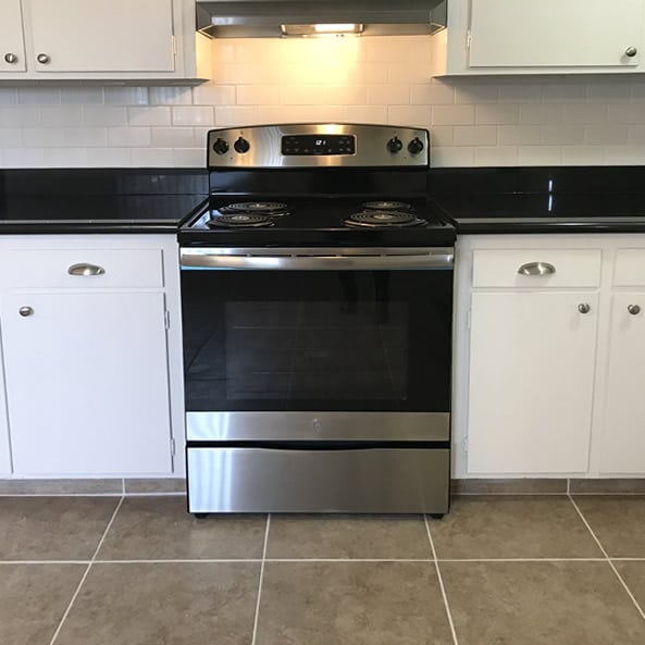 Kitchen with upgraded stainless range and hood